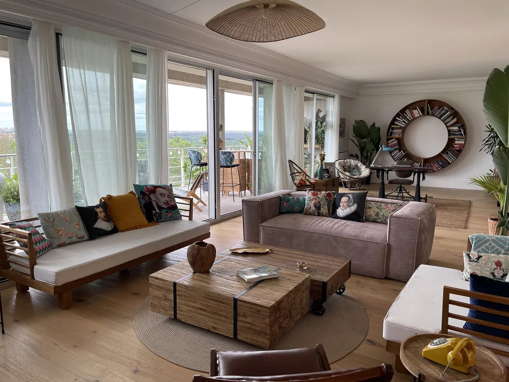 Modern living room with a sofa, coffee table, and decorative items.