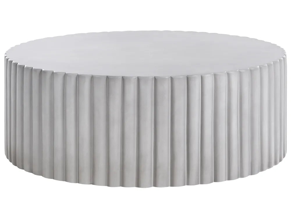 Round ottoman with pleated design on a white background