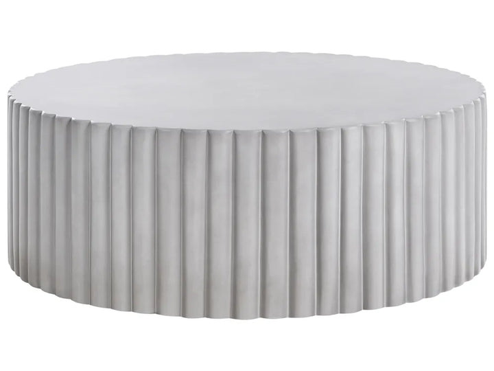 Round ottoman with pleated design on a white background