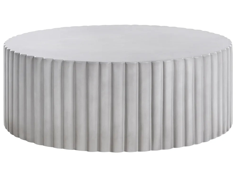 Round ottoman with pleated design on a white background