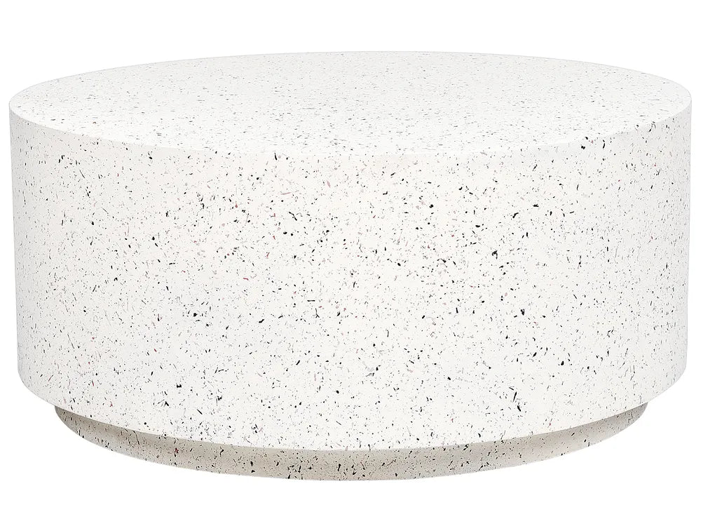 Round concrete coffee table with a speckled surface on a white background