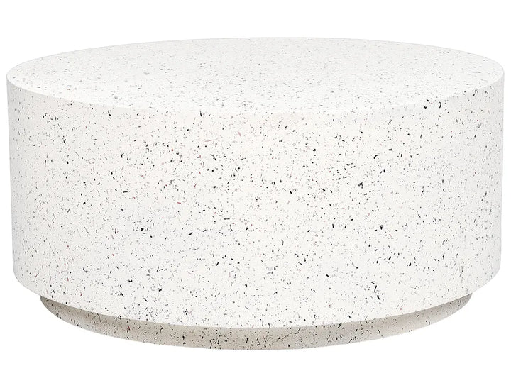 Round concrete coffee table with a speckled surface on a white background