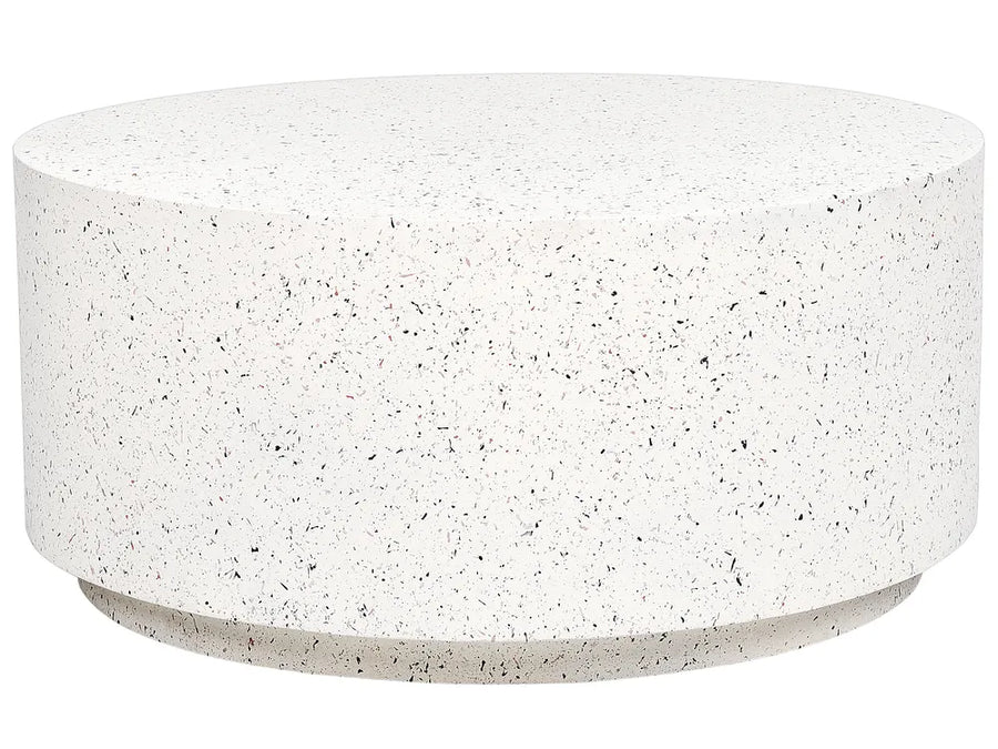 Round concrete coffee table with a speckled surface on a white background
