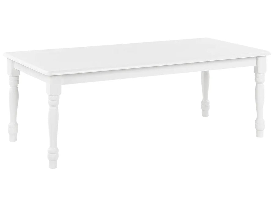 White table with decorative legs on a white background