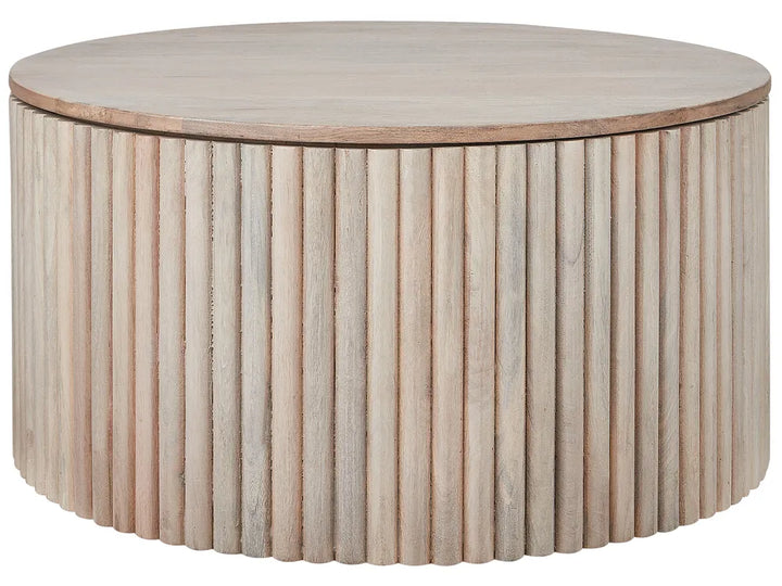 Round wooden coffee table with a ribbed surface design on a white background