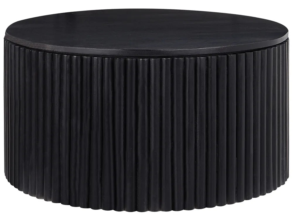 Round black coffee table with ribbed surface design on a white background