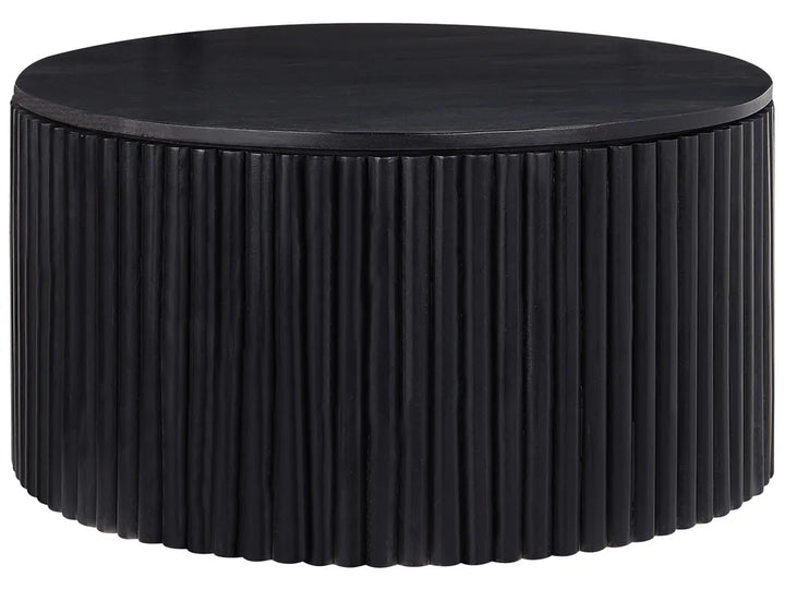 Round black coffee table with ribbed surface design on a white background