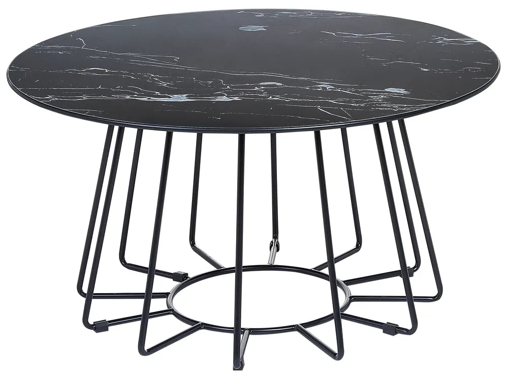 Round black marble table with metal base on a white background