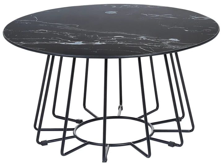 Round black marble table with metal base on a white background