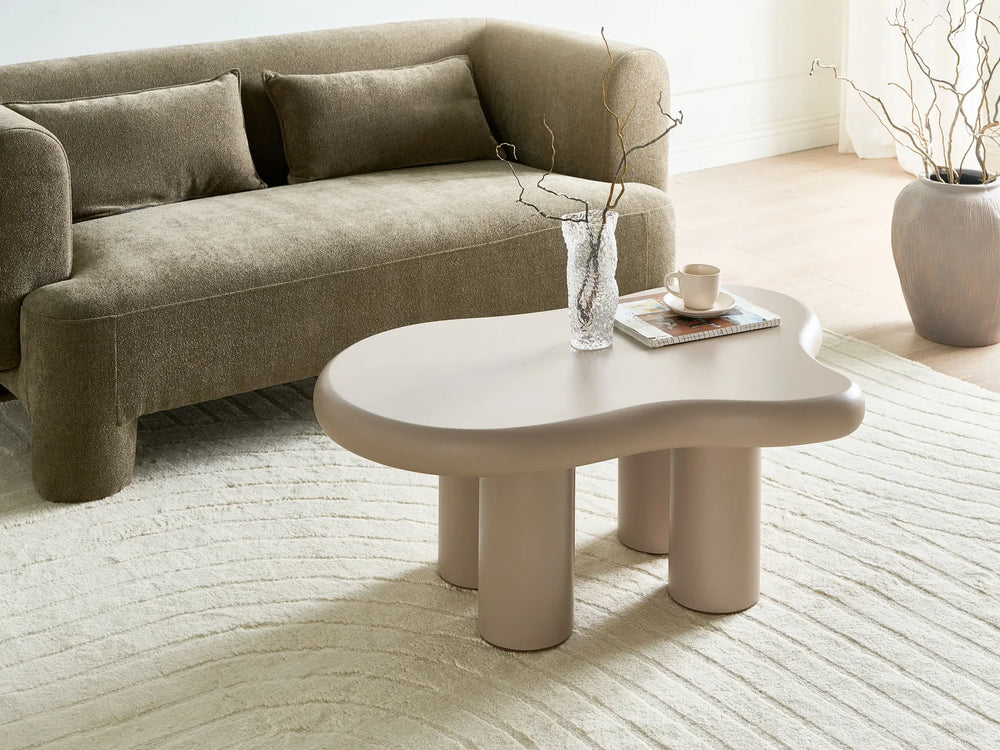 Beige sofa with a modern coffee table in a living room setting