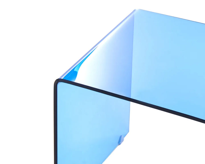 Clear blue glass block on a white background