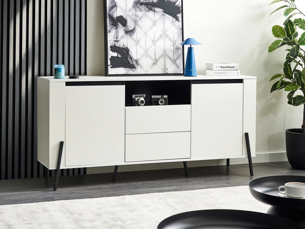 Modern white sideboard with black accents in a living room setting.