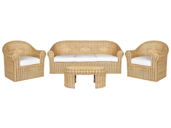 A Boho-inspired garden sofa set made of natural rattan, including a 3-seater sofa, two armchairs, and a coffee table, all equipped with white cushion covers.