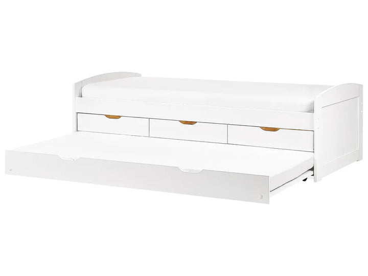 White bed with storage drawers on a white background