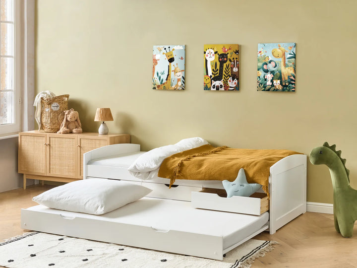 Children's bedroom with a white bed, wooden sideboard, and wall art.