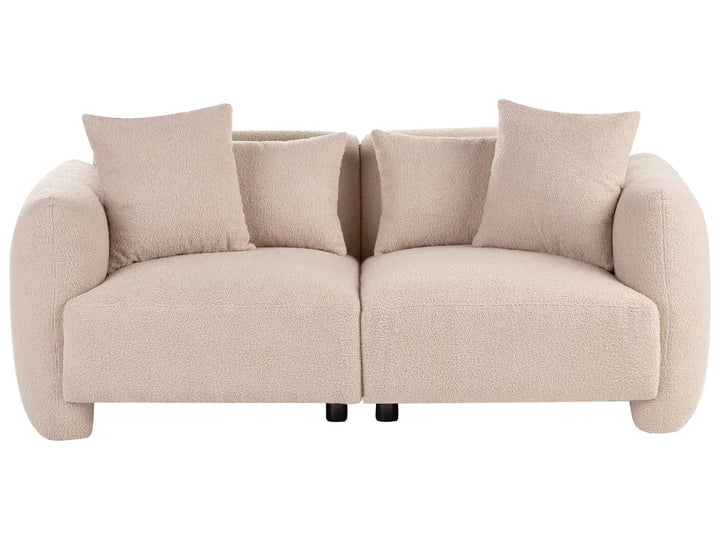 A modern two-seater sofa in a textured bouclé fabric, upholstered in a light beige color, featuring four matching throw pillows and small black legs, shown against a plain white background.