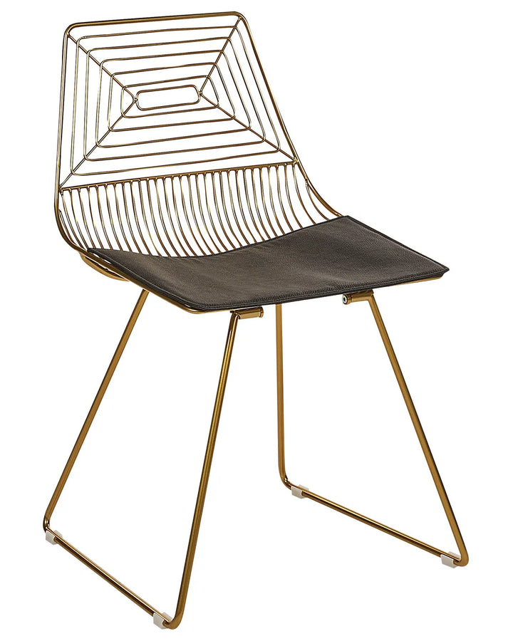 A modern wireframe dining chair with a gold metal frame and a dark gray upholstered seat, shown against a plain white background.