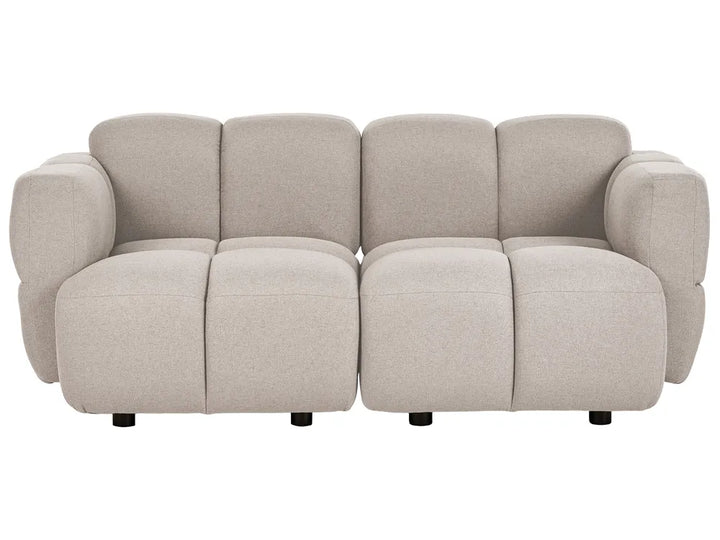 A modern modular upholstered sofa with rounded blocky cushions and wide armrests, shown from the front on a plain white background.
