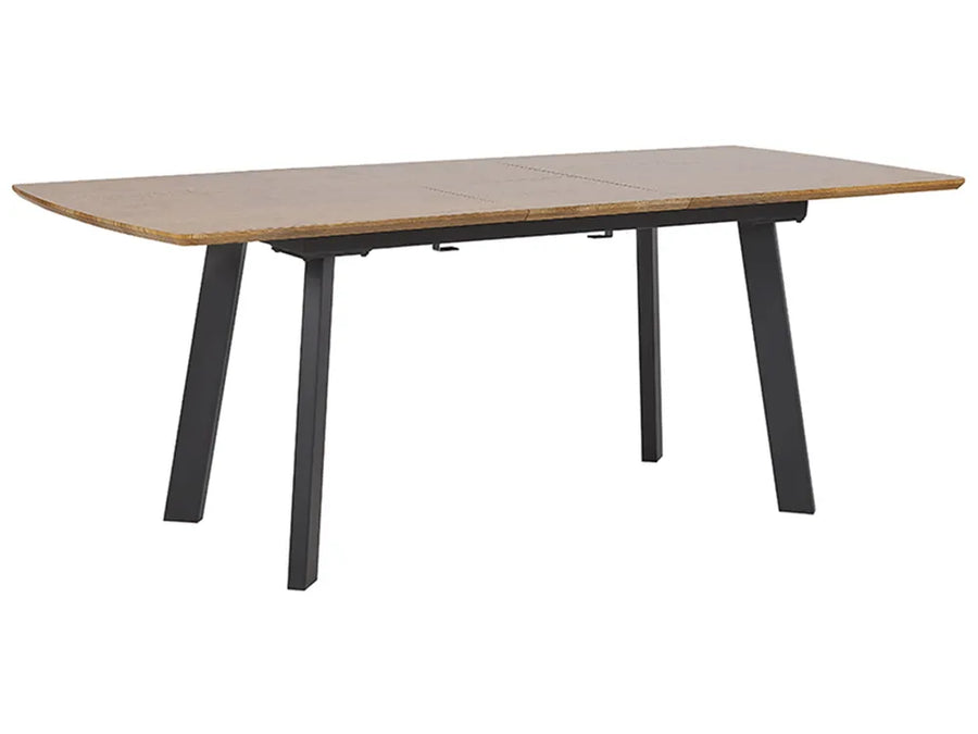 Wooden dining table with black legs on a white background