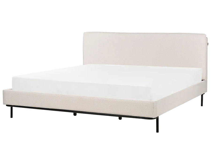 Beige bed frame with white mattress on a white background
