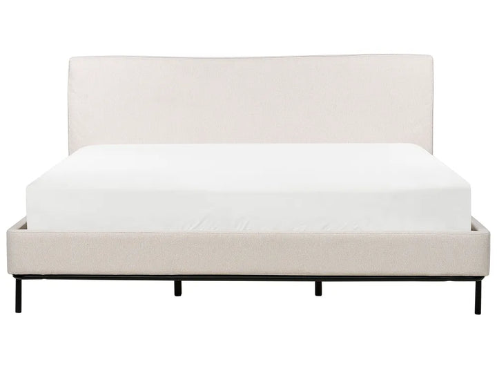 Beige bed frame with white mattress on a white background