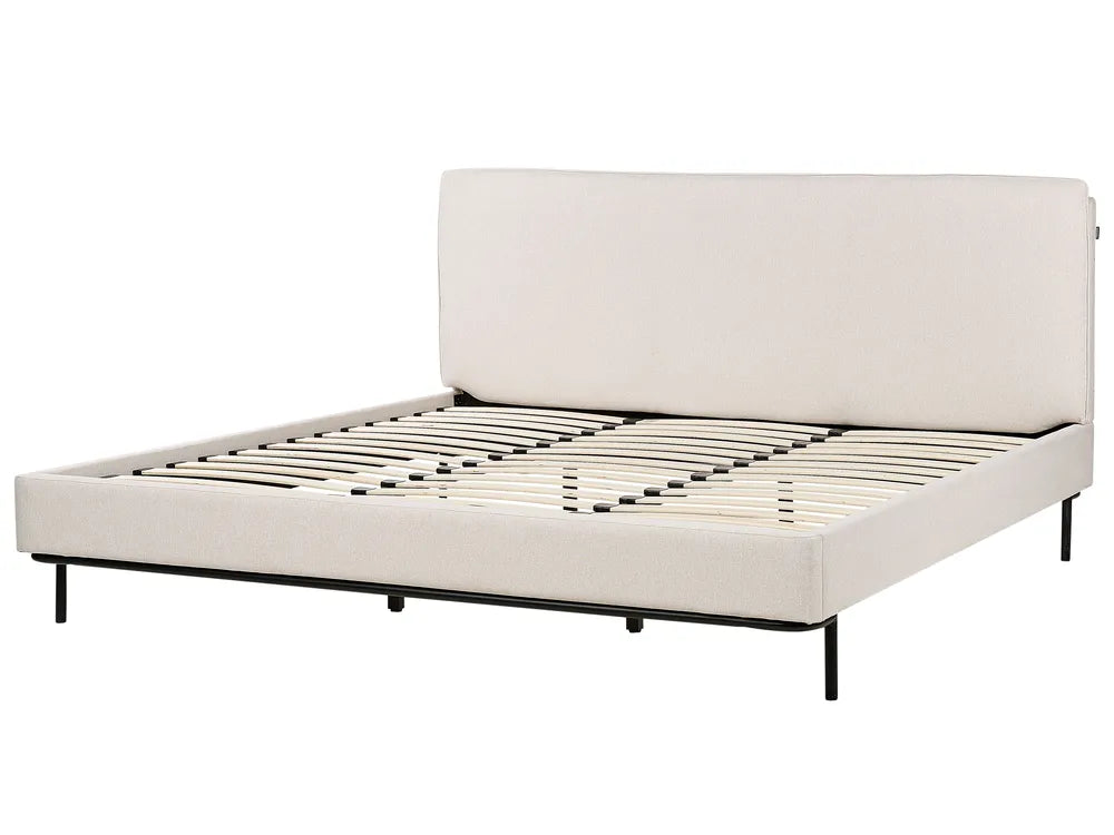 Beige upholstered bed frame on a white background