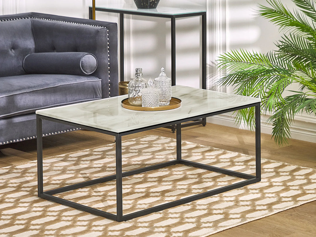 Coffee table with decorative items in a living room setting