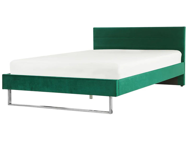 Green bed frame with white mattress on a white background