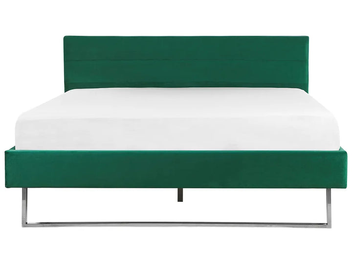 Green bed frame with white mattress on a white background