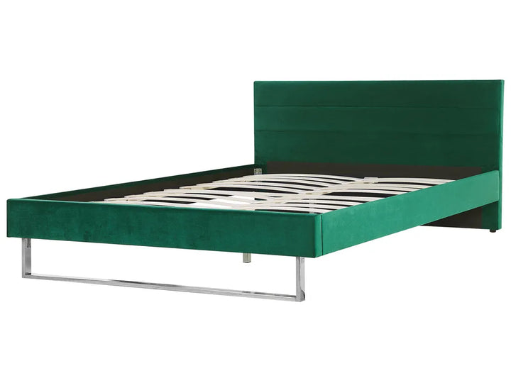 Green bed frame with zebra pattern mattress on a white background