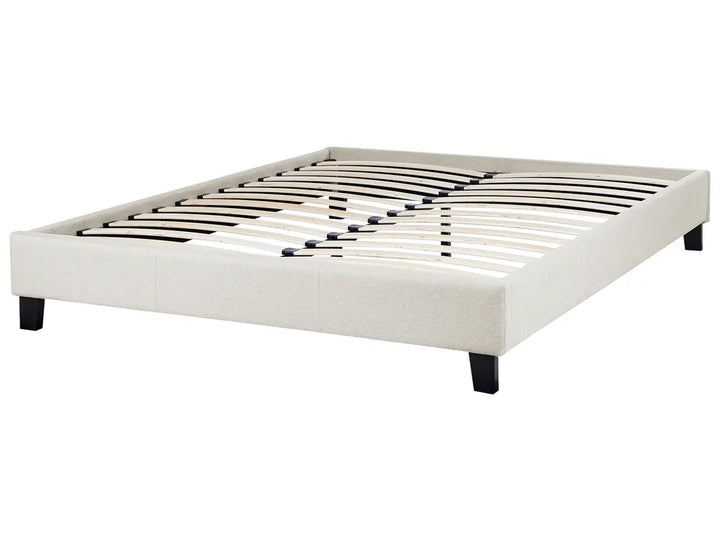 White bed frame with metal slats on a white background