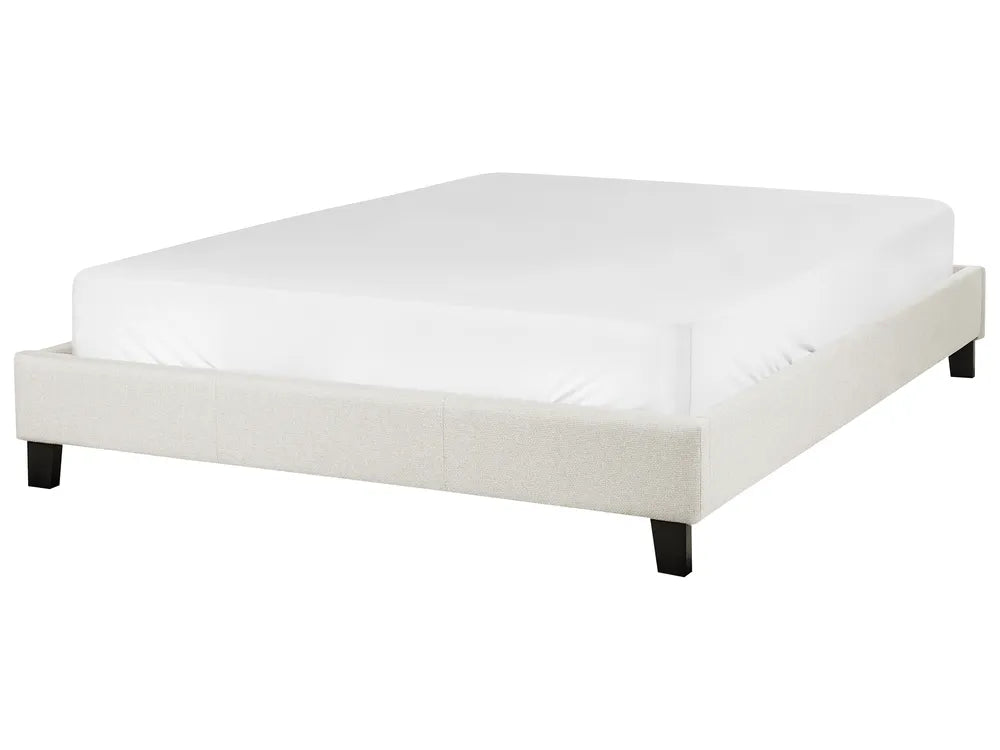 White bed frame with mattress on a white background