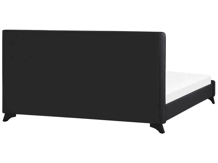 Minimalist black fabric bed with button tufting