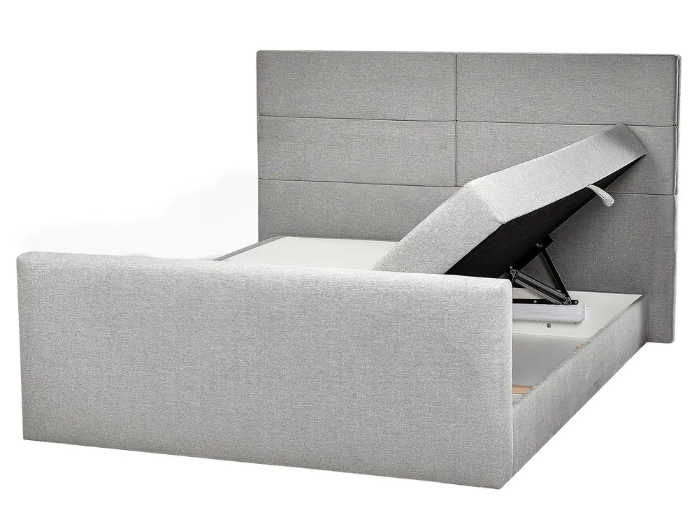 Gray upholstered bed with storage compartments on a white background