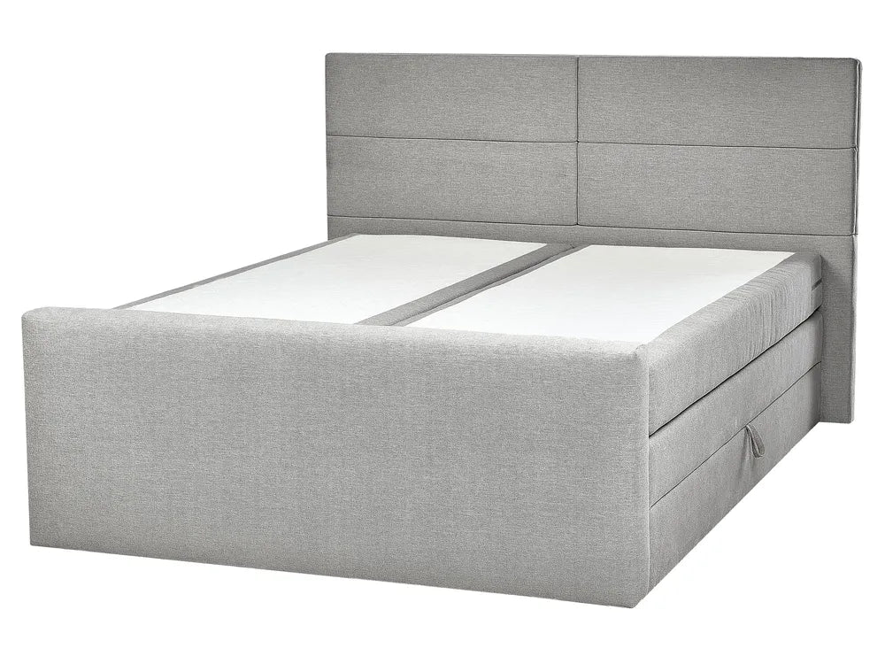 Gray upholstered bed with a headboard on a white background