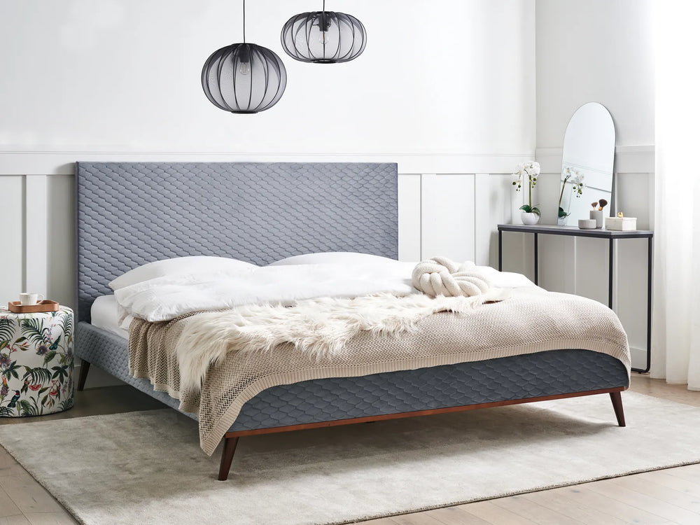 Modern upholstered bed with soft velvet finish
