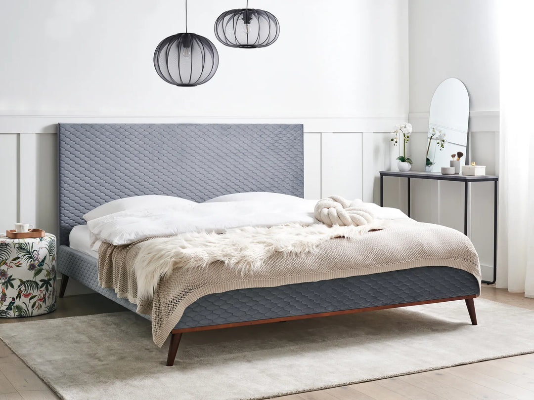 Modern upholstered bed with soft velvet finish