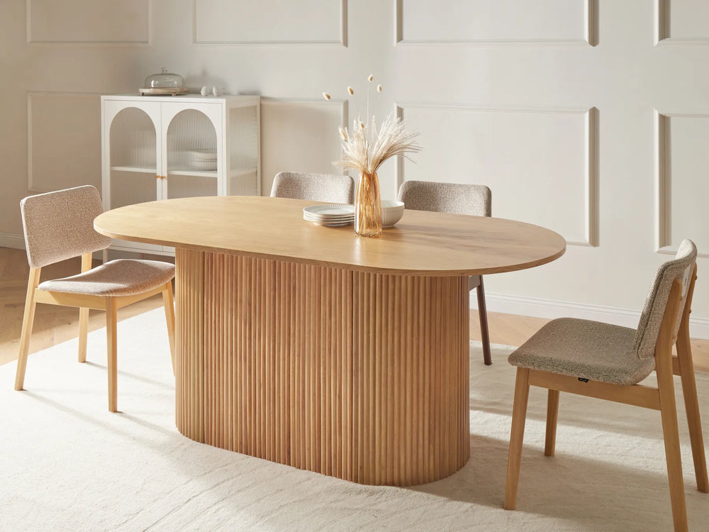 Wooden dining table with chairs in a modern kitchen setting