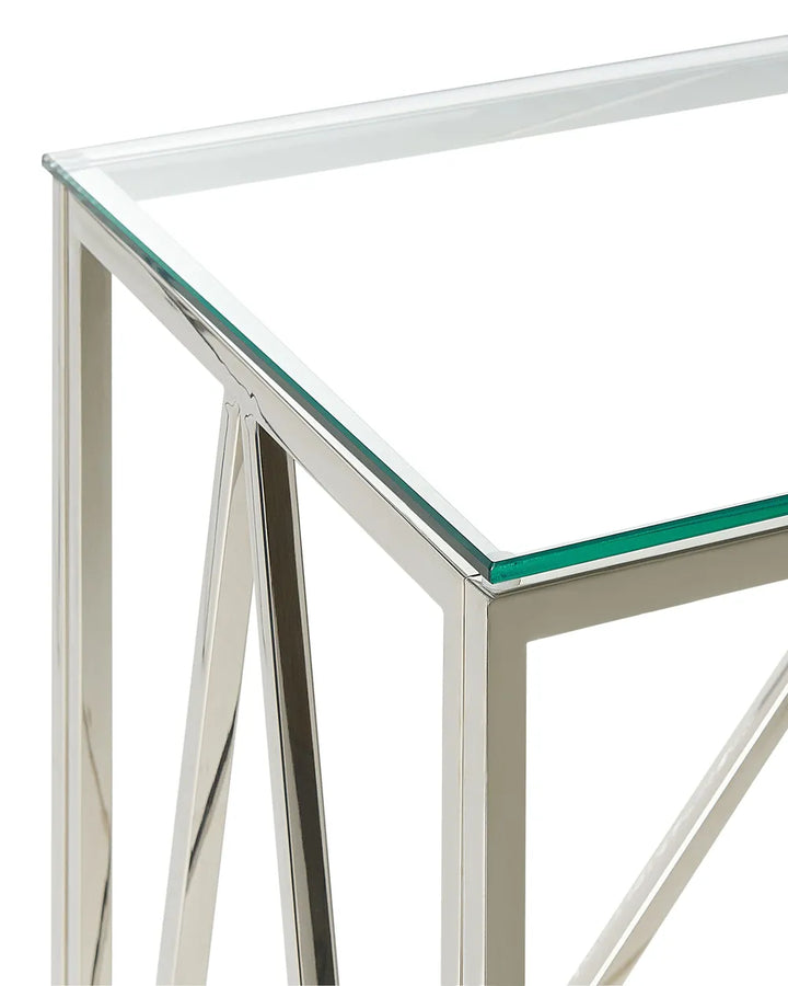 Glass table with metal frame on a white background