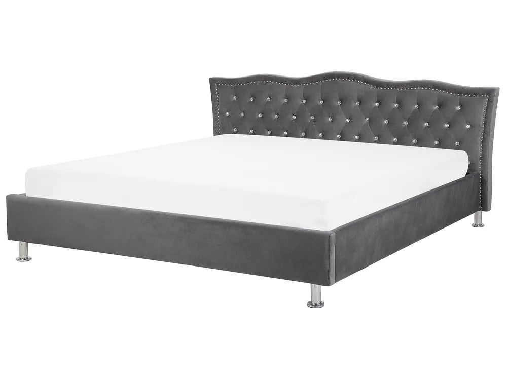 Gray upholstered bed with tufted headboard on a white background