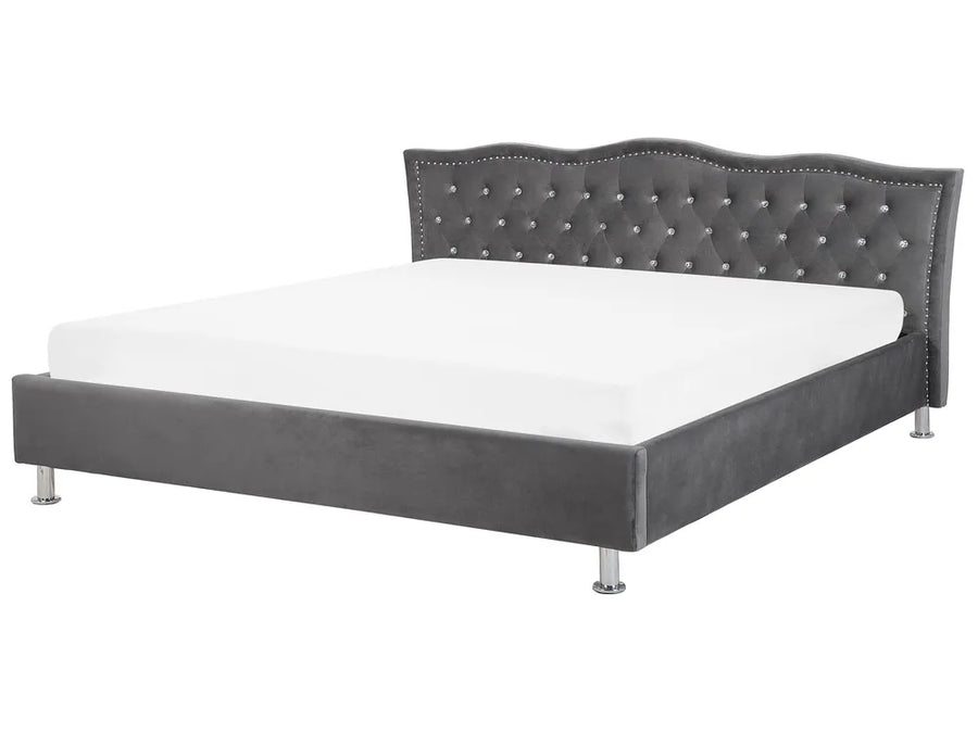 Gray upholstered bed with tufted headboard on a white background
