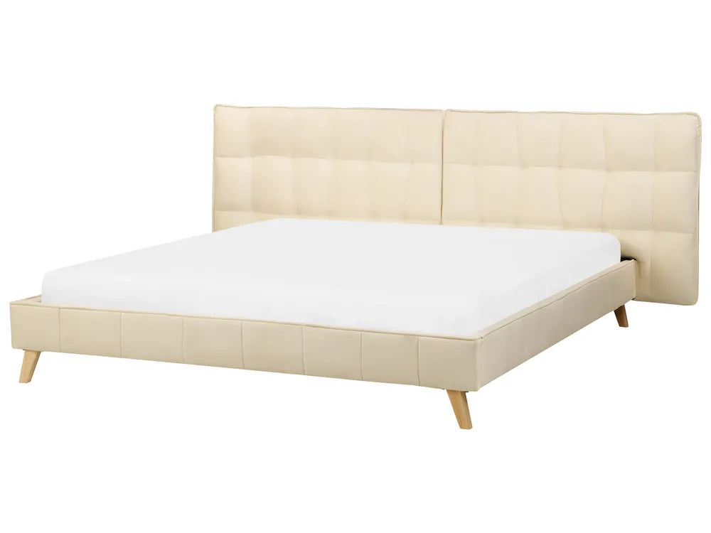 Beige bed frame with white mattress on a white background