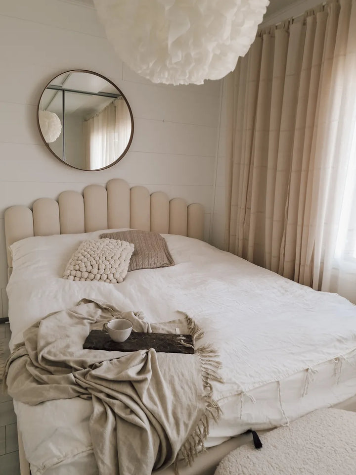 Elegant velvet bed with tufted headboard and slatted base