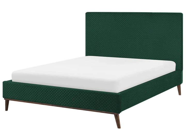 Green bed with white mattress on a white background