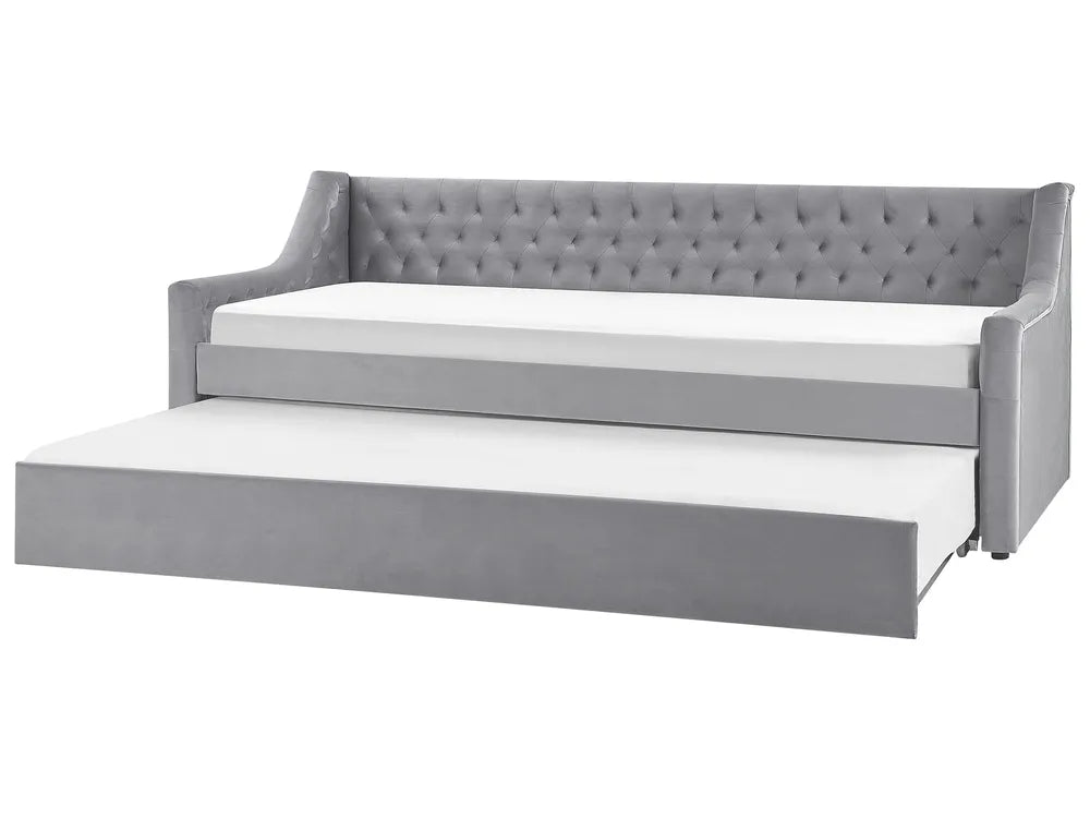Gray upholstered bed with white mattress on a white background