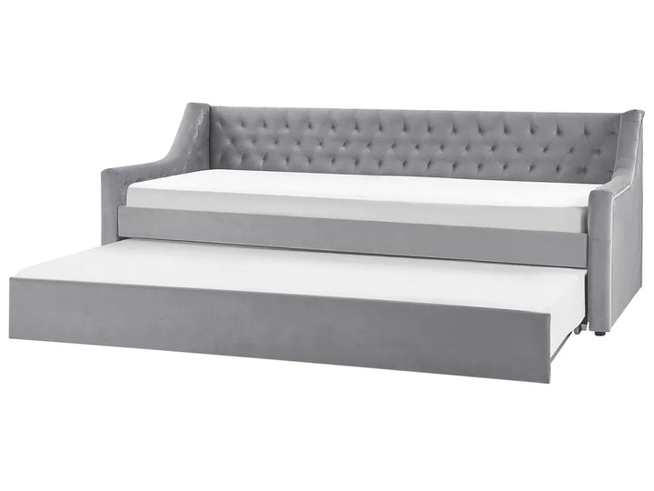 Gray upholstered bed with white mattress on a white background