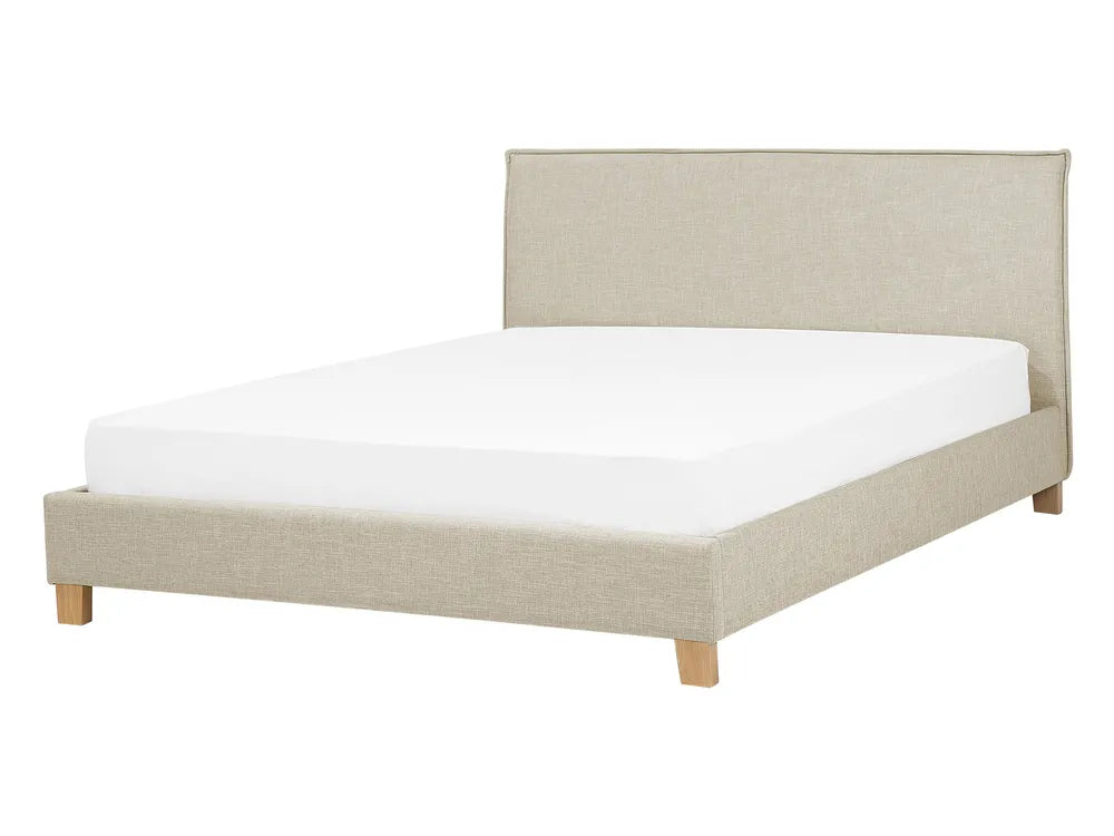 Beige upholstered bed with white mattress on a white background
