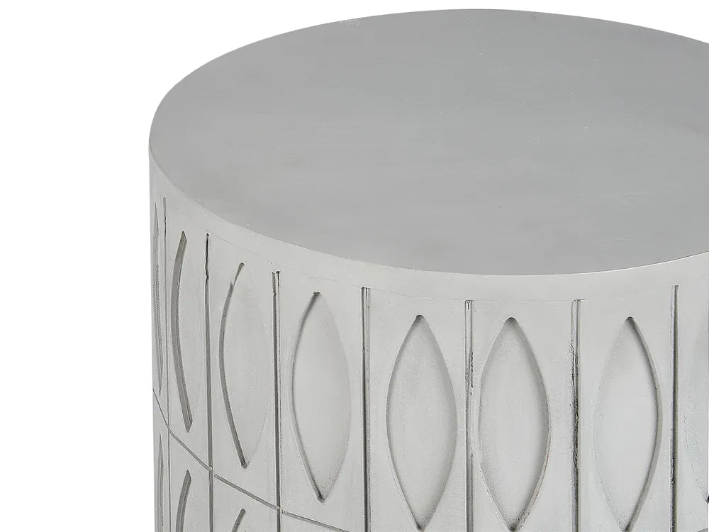 Decorative cylindrical stool with cut-out patterns on a white background