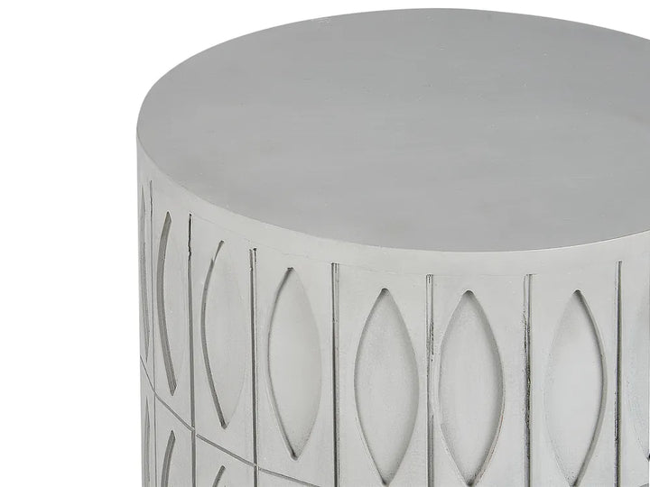 Decorative cylindrical stool with cut-out patterns on a white background