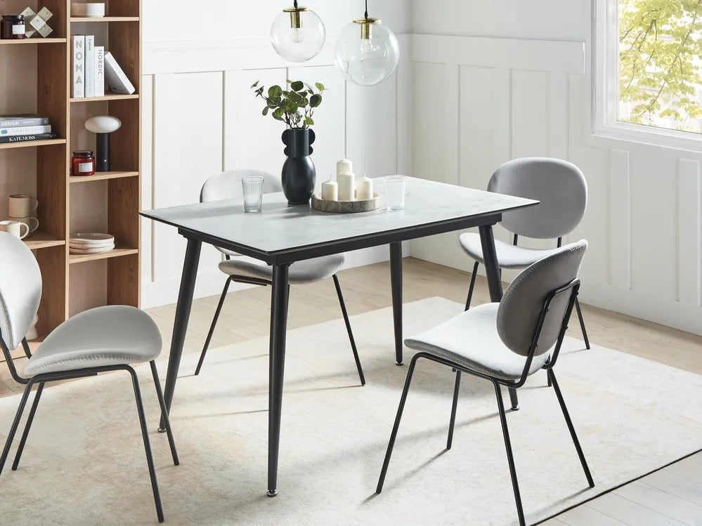 Dining room with a table and chairs in a modern interior setting.
